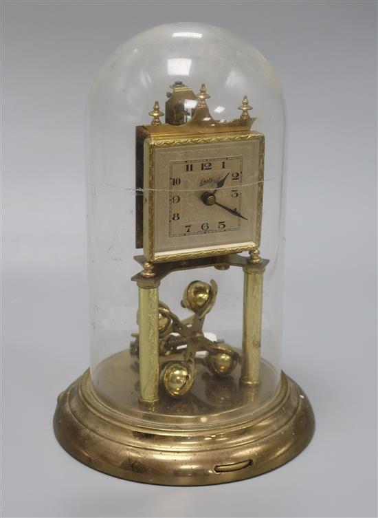 A gilt brass torsion clock under dome height 31cm